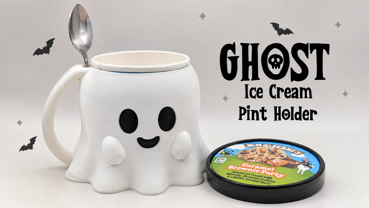 White smiling ghost ice cream pint holder with handle and side spoon rest, pictured with a pint tub