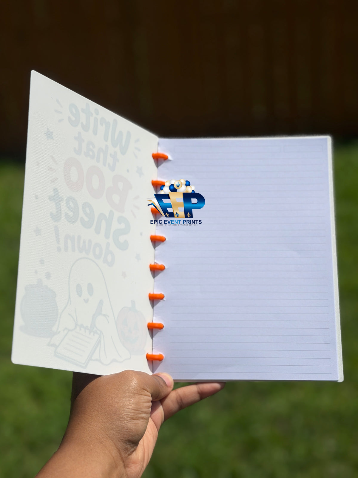 Halloween notebook cover saying Write that BOO Sheet down with writing ghost, pumpkin, and cauldron